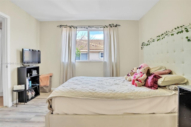 bedroom with light hardwood / wood-style floors