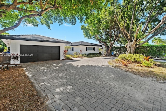 single story home featuring a garage