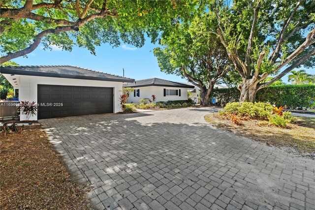 single story home featuring a garage