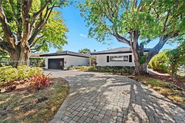 ranch-style house featuring a garage