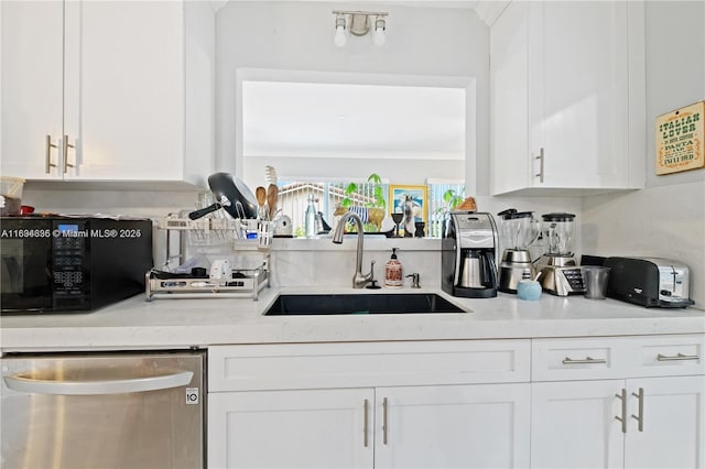 bar featuring stainless steel dishwasher, light stone counters, white cabinets, and sink