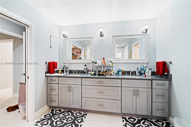 bathroom with tile patterned flooring and vanity