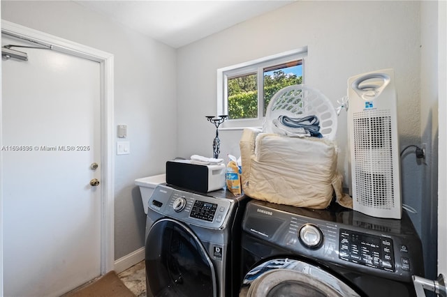 washroom with separate washer and dryer