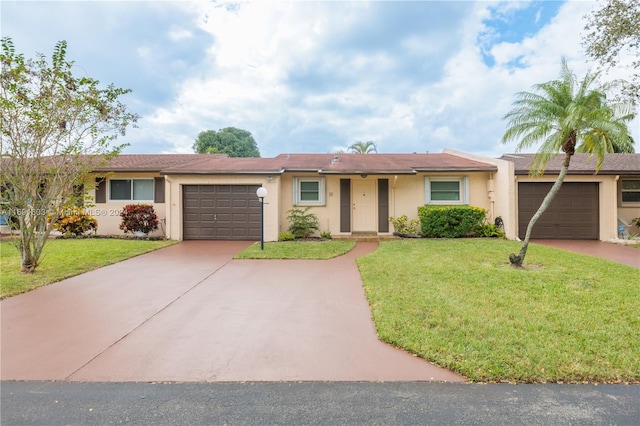 ranch-style home with a garage and a front yard