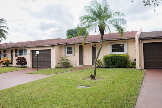 ranch-style house with a front lawn and a garage