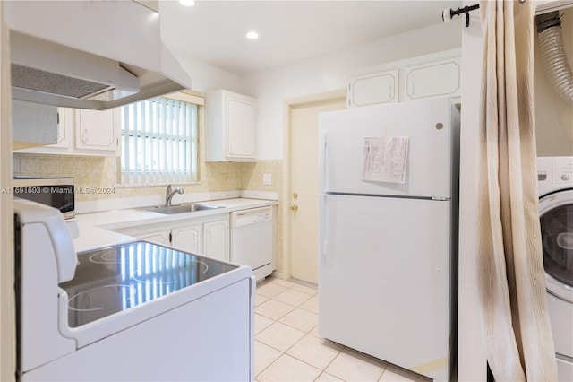7708 Margate Blvd Unit C3-4, Margate, FL 33063 - kitchen featuring white appliances, wall chimney range hood, white cabinetry, light tile patterned flooring, and decorative backsplash