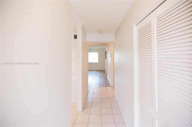 7708 Margate Blvd Unit C3-4, Margate, FL 33063 - corridor featuring light tile patterned floors and a textured ceiling
