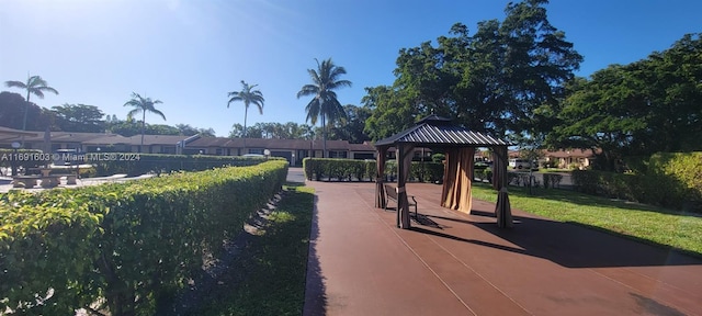 view of property's community with a gazebo and a lawn