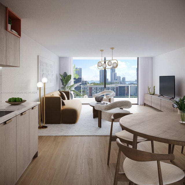 living room featuring light hardwood / wood-style flooring, an inviting chandelier, a healthy amount of sunlight, and a wall of windows