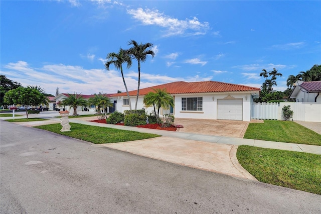 view of front of home with a garage and a front yard