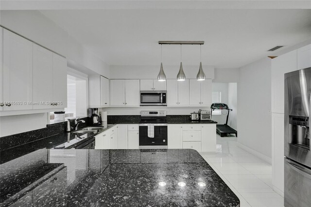 8925 SW 11th St, Miami, FL 33174 - kitchen with appliances with stainless steel finishes, a sink, white cabinetry, and plenty of natural light