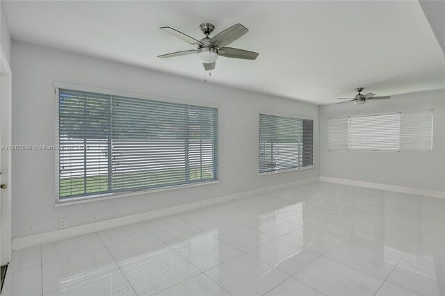 8925 SW 11th St, Miami, FL 33174 - tiled empty room with ceiling fan and baseboards