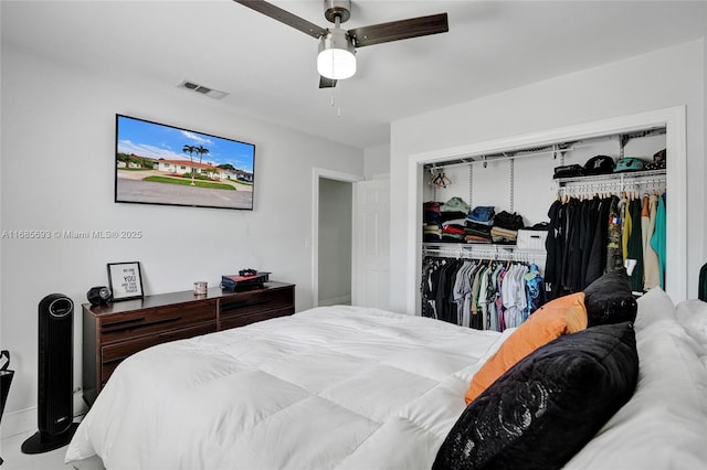 bedroom with ceiling fan and a closet