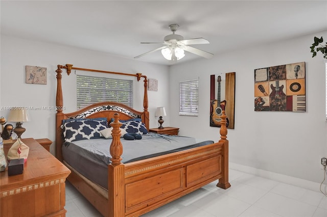 bedroom featuring light tile patterned floors and ceiling fan