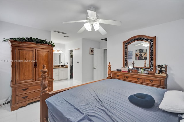 bedroom featuring light tile patterned flooring, ceiling fan, and ensuite bathroom