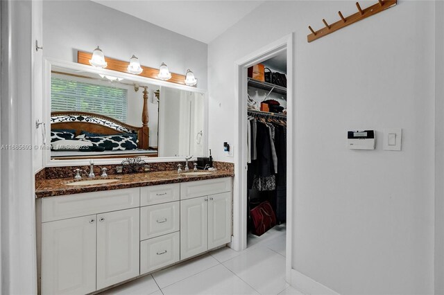 bathroom with vanity and tile patterned flooring