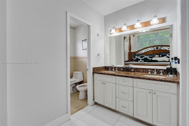 8925 SW 11th St, Miami, FL 33174 - ensuite bathroom with tile patterned floors, toilet, double vanity, and a bidet