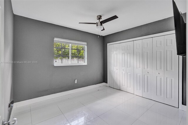 8925 SW 11th St, Miami, FL 33174 - unfurnished bedroom featuring baseboards, a closet, and ceiling fan