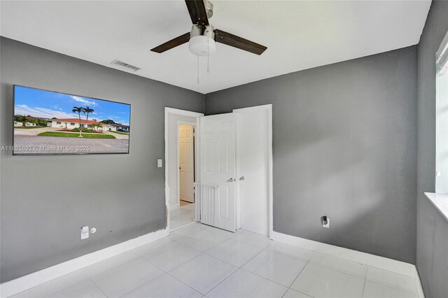 8925 SW 11th St, Miami, FL 33174 - unfurnished bedroom with baseboards, ceiling fan, and tile patterned floors