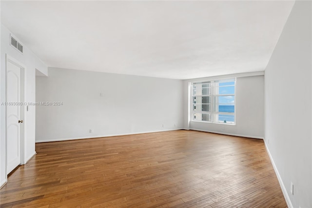 spare room featuring hardwood / wood-style flooring