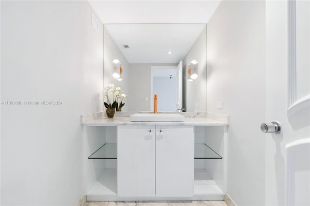 bathroom featuring tile patterned floors and vanity