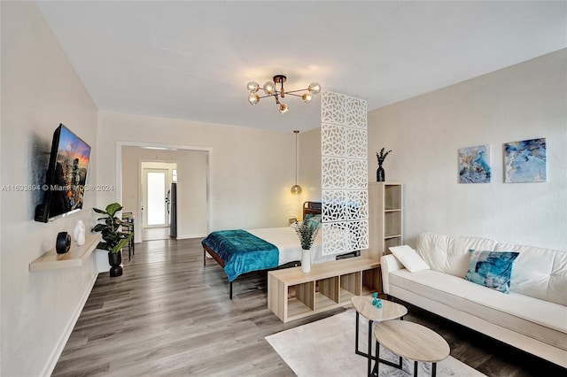 living room featuring a notable chandelier and hardwood / wood-style flooring