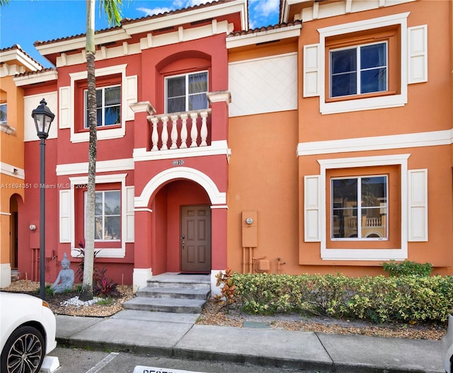 view of property with a balcony