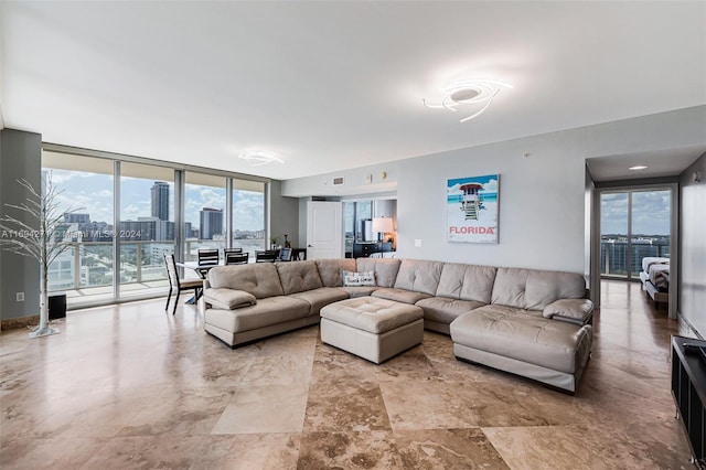 living room featuring a wall of windows