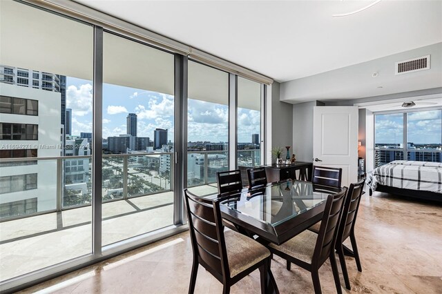 dining space with expansive windows