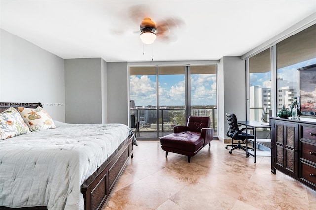 bedroom featuring access to exterior, expansive windows, and ceiling fan