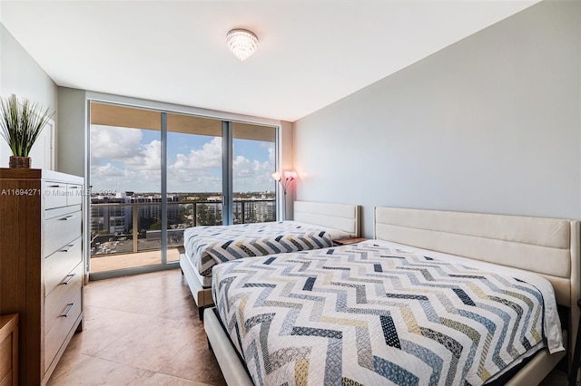 bedroom featuring multiple windows, light tile patterned flooring, floor to ceiling windows, and access to exterior