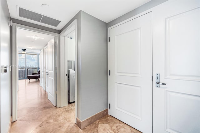 hallway featuring washer / clothes dryer