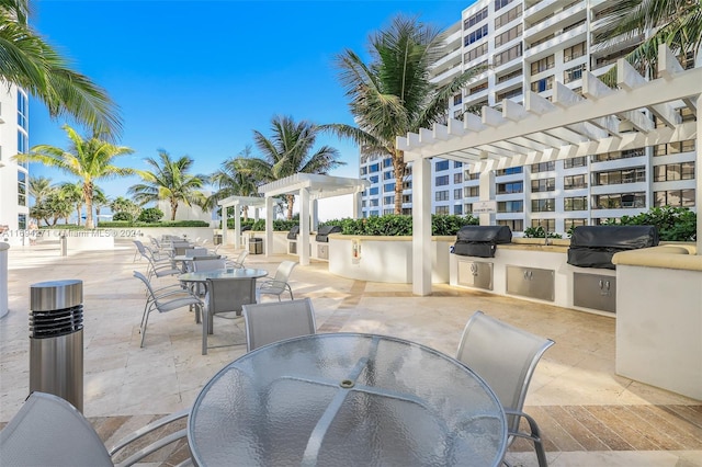 view of patio / terrace featuring a pergola, area for grilling, and grilling area