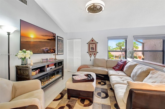 living room with lofted ceiling