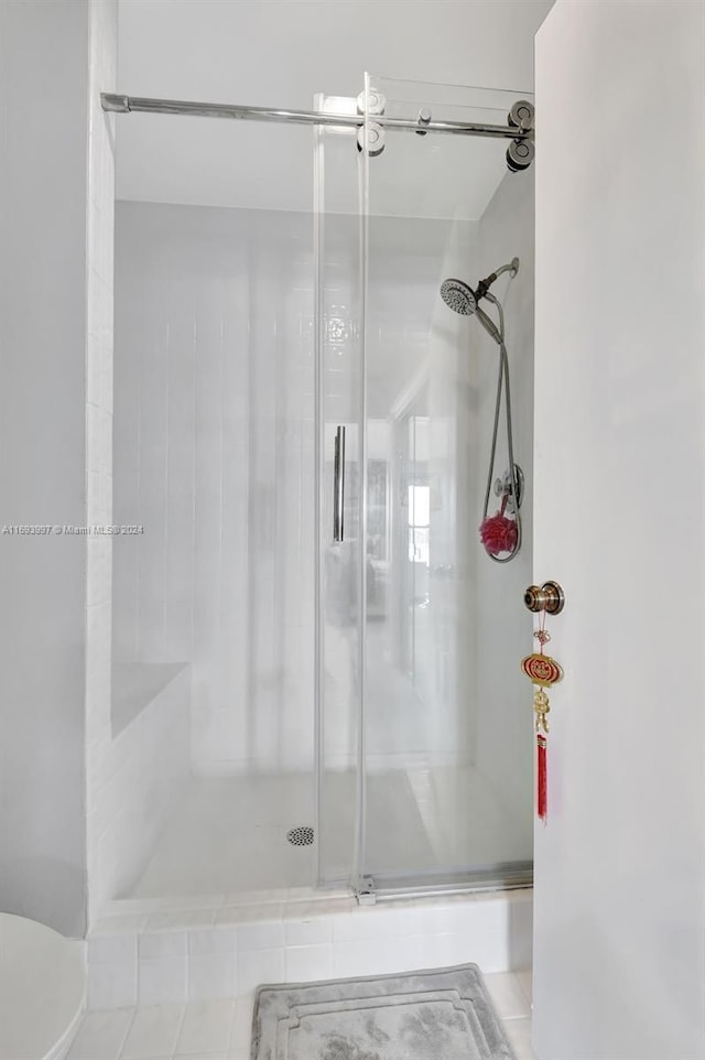 bathroom featuring an enclosed shower