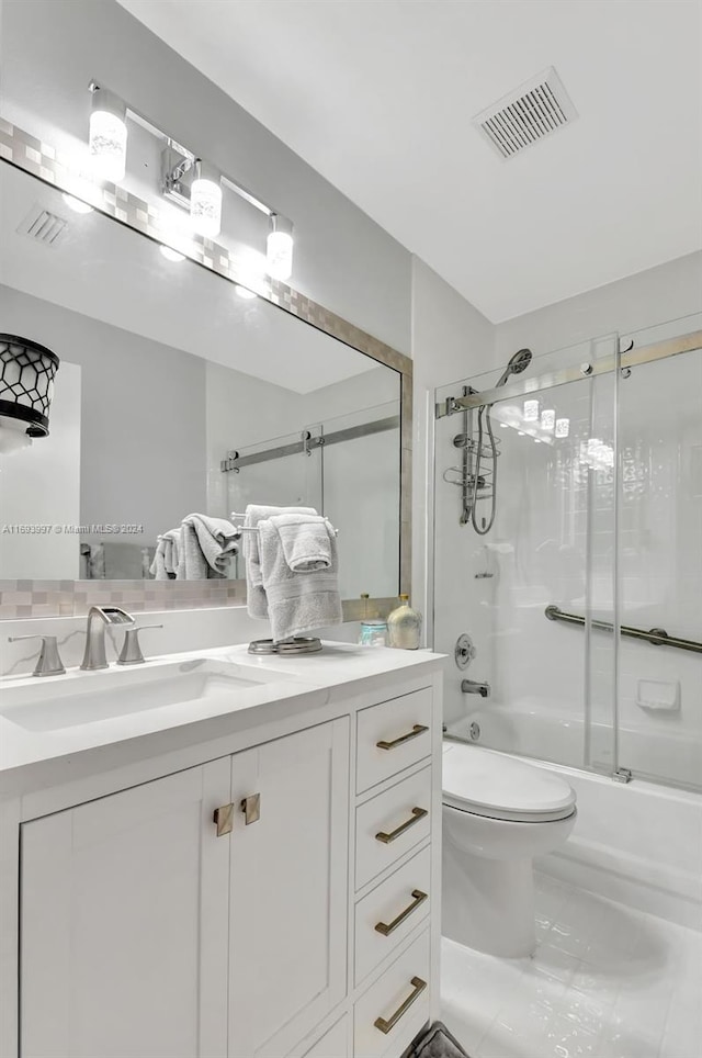 full bathroom with vanity, toilet, and enclosed tub / shower combo