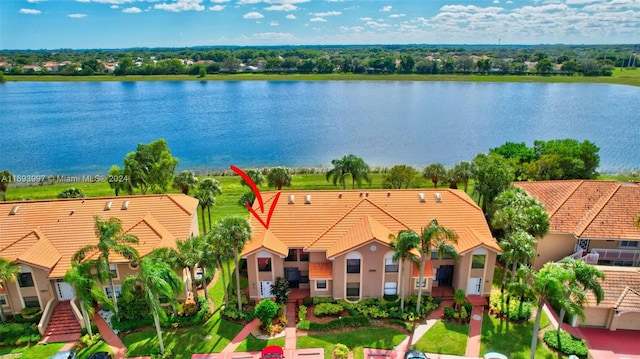 birds eye view of property featuring a water view