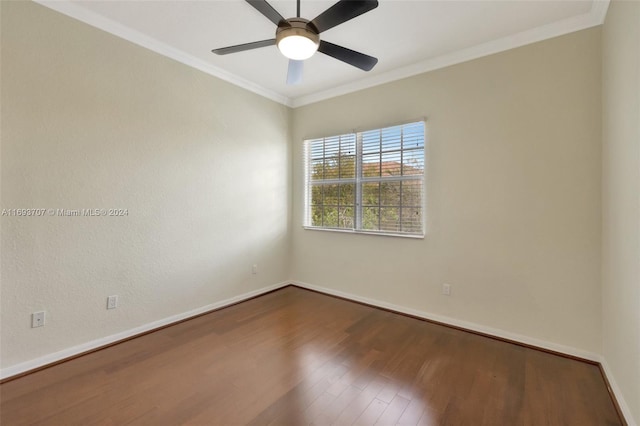 empty room with ceiling fan, hardwood / wood-style floors, and ornamental molding