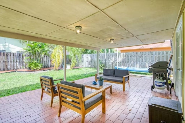 view of patio with outdoor lounge area and grilling area