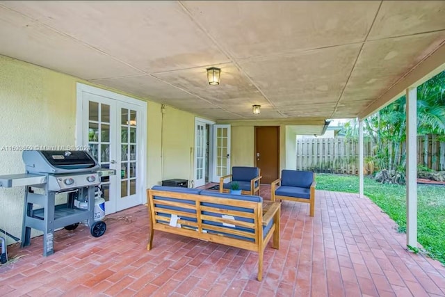 view of patio / terrace with french doors, an outdoor hangout area, and a grill