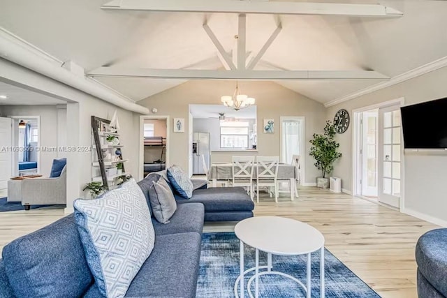 living room featuring an inviting chandelier, lofted ceiling with beams, and light wood-type flooring