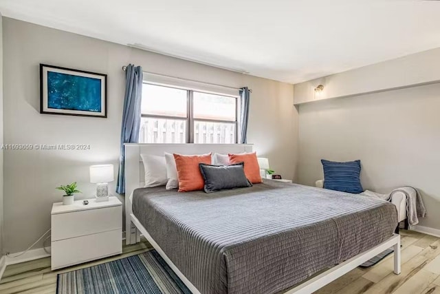 bedroom with light hardwood / wood-style flooring