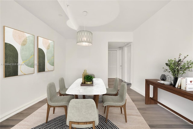 dining space featuring wood-type flooring