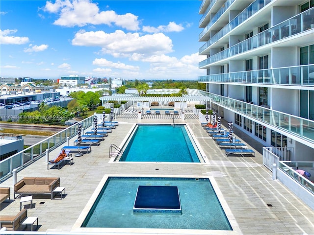 view of pool featuring a patio area