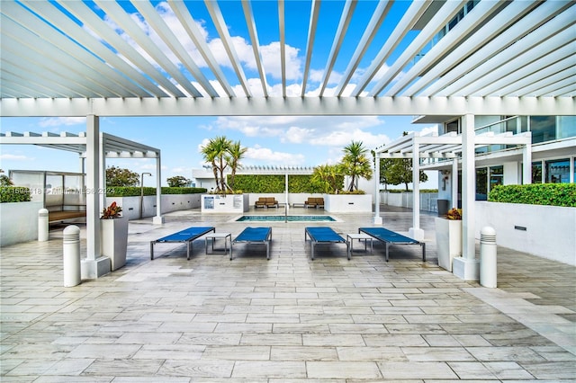 view of patio featuring a pergola and an outdoor kitchen