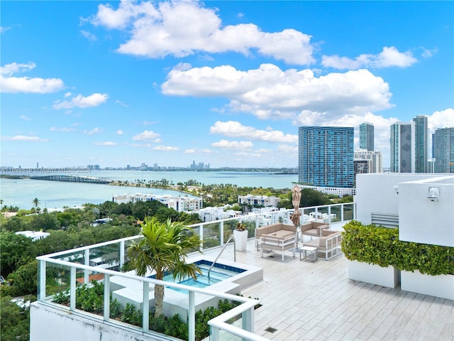 balcony featuring a water view