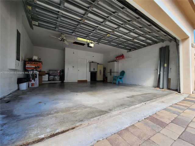 garage featuring a garage door opener and ceiling fan