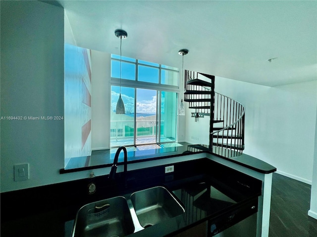 kitchen featuring dark carpet and sink