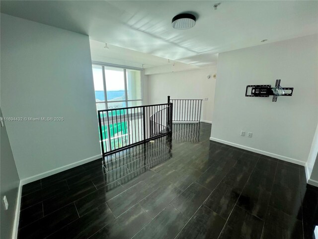 300 S Biscayne Blvd Unit 826, Miami, FL 33131 - spare room with dark wood-type flooring and a pendent fire sprinkler