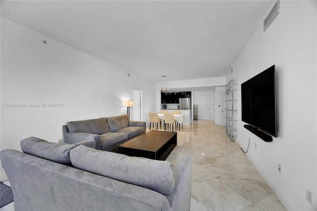 10 Aragon Ave Unit 810, Coral Gables, FL 33134 - living room featuring light marble finish floors and baseboards